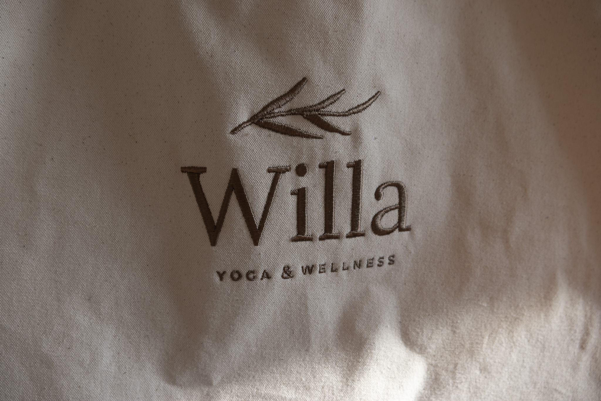 Willa Wellness Natural canvas yoga mat tote bag displayed upright